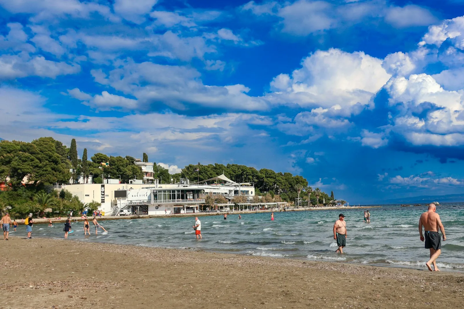 croatia-coast-family-beach-bacvice-split-summer Split Bacivce Beach on the Croatian coast with families swimming and enjoying a sunny summer day