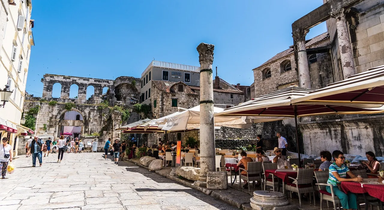 croatia-coffee-culture-morning-old-town-peristil Morning coffee culture in a Croatian old town Split with locals sitting at café terraces on Peristil