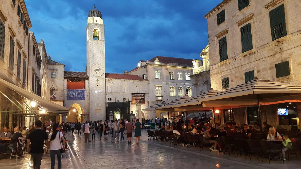croatia-old-town-dubrovnik-tourist-restaurants-evening Busy old town square in Dubrovnik Croatia with many restaurants catering to tourists