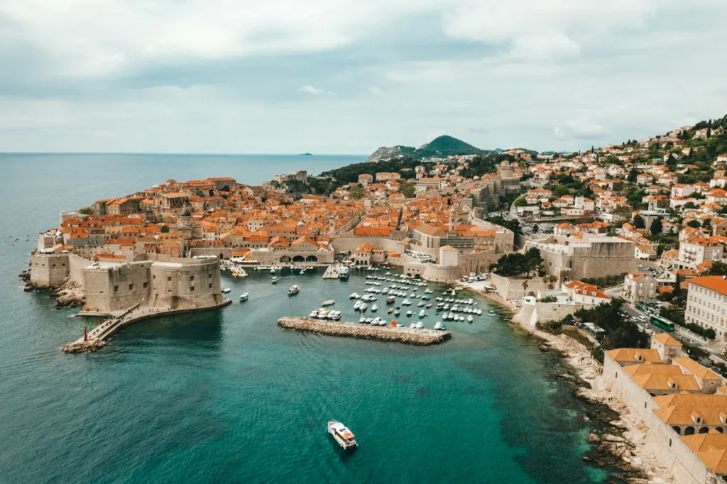 Dubrovnik old town port and walls panoramic view with sea in background