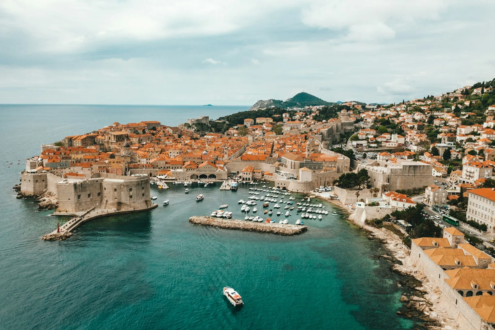 Dubrovnik old town port and walls panoramic view with sea in background