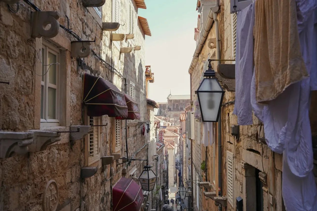A narrow street in Dubrovnik’s old town, showing everyday life beyond tourist routes