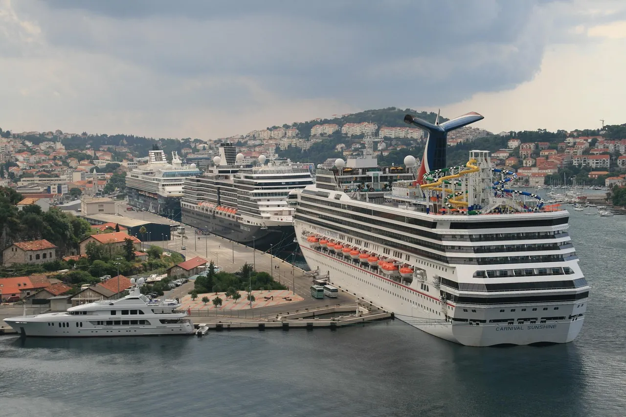 dubrovnik-cruise-ship-port-gruz Cruise ship docked in Dubrovnik port Gruž during peak summer season, showing tourist crowds behind the question is Dubrovnik expensive