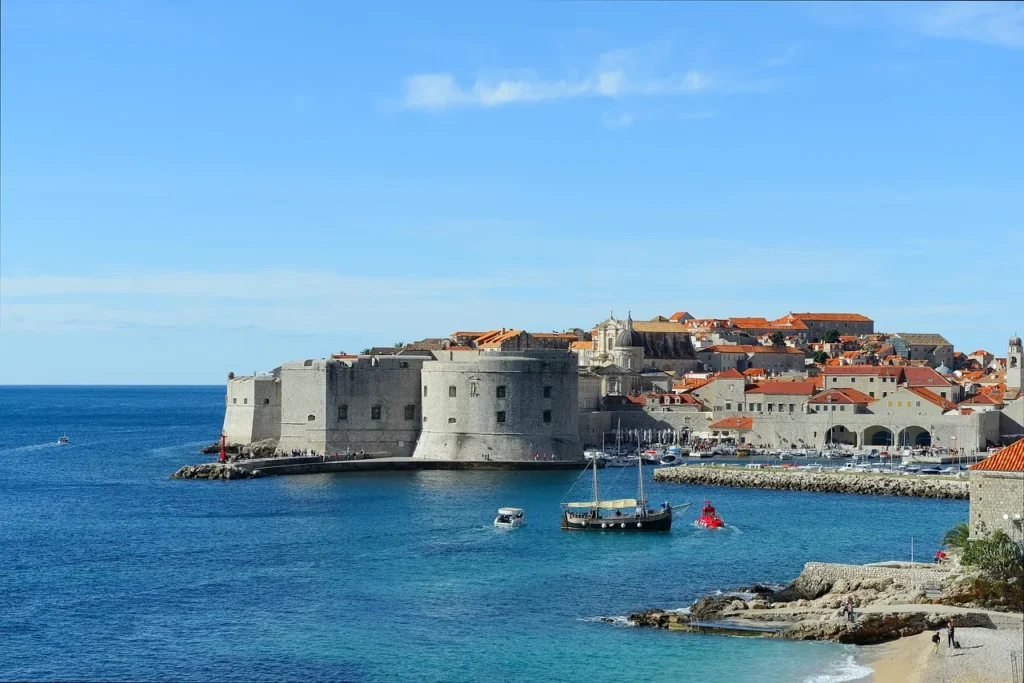 Distant view of Dubrovnik Old Town surrounded by city walls and the Adriatic Sea