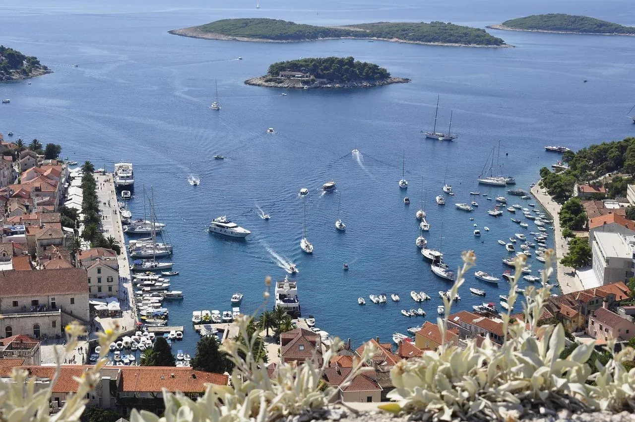 Hvar Town harbour on Hvar island, Croatia, with boats, old town and nearby islands