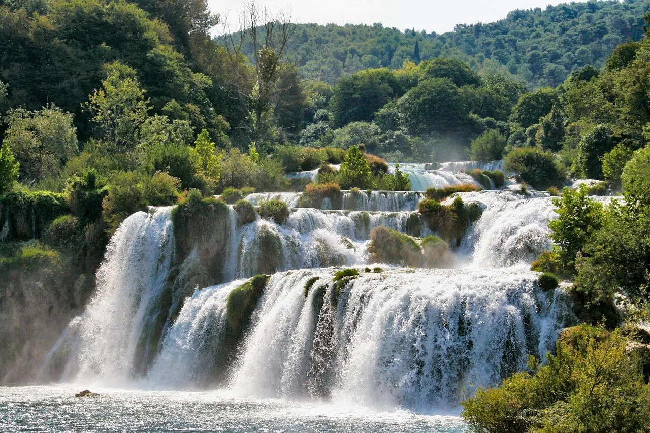 krka-national-park-waterfalls-croatia Waterfalls in Krka National Park, Croatia, surrounded by lush green forest
