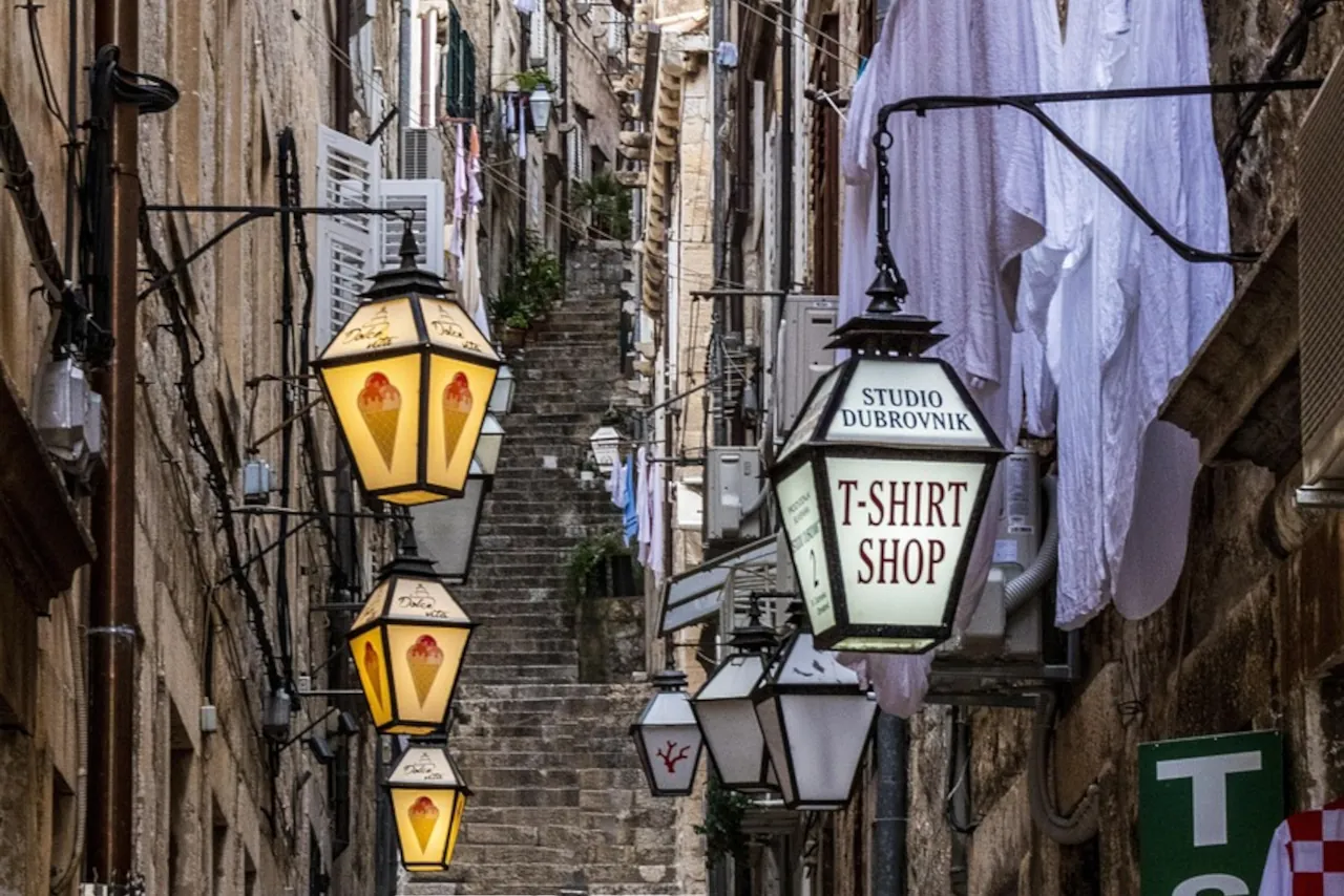 dubrovnik-old-town-typical-dalmatian-croatia-street-with-stairs Steep stone stairs in Dubrovnik Old Town lined with traditional lanterns
