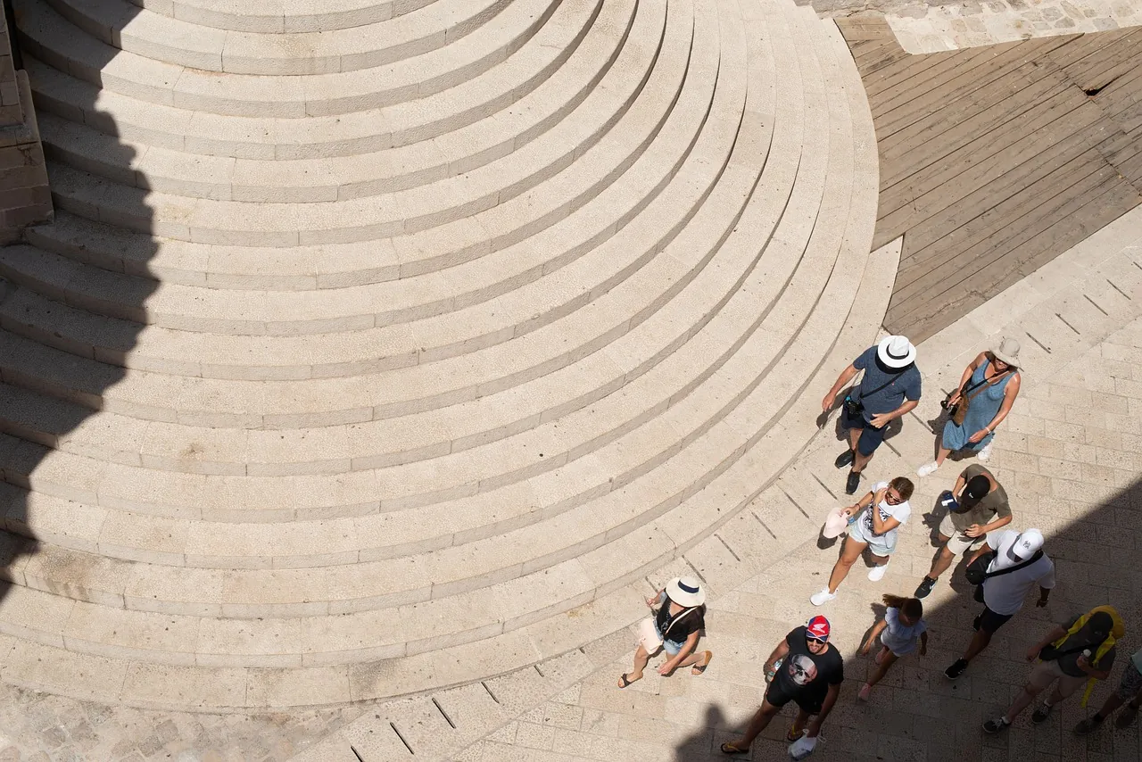 jesuit-stairs-in-dubrovnik-old-town-croatia Jesuit Stairs in Dubrovnik Old Town Croatia with visitors walking on a sunny day
