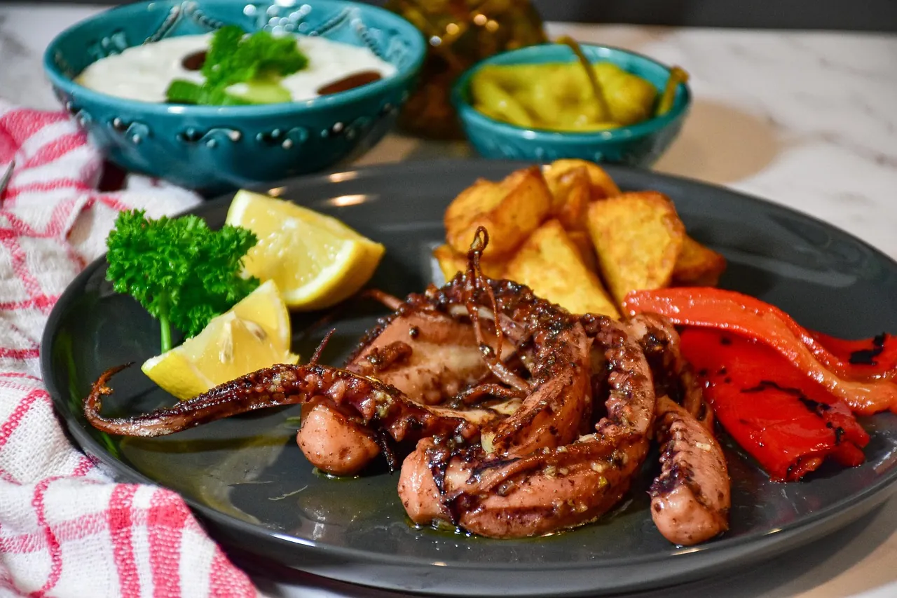 octopus-under-peka-croatian-traditional-dish Octopus prepared under peka with potatoes, lemon and grilled vegetables