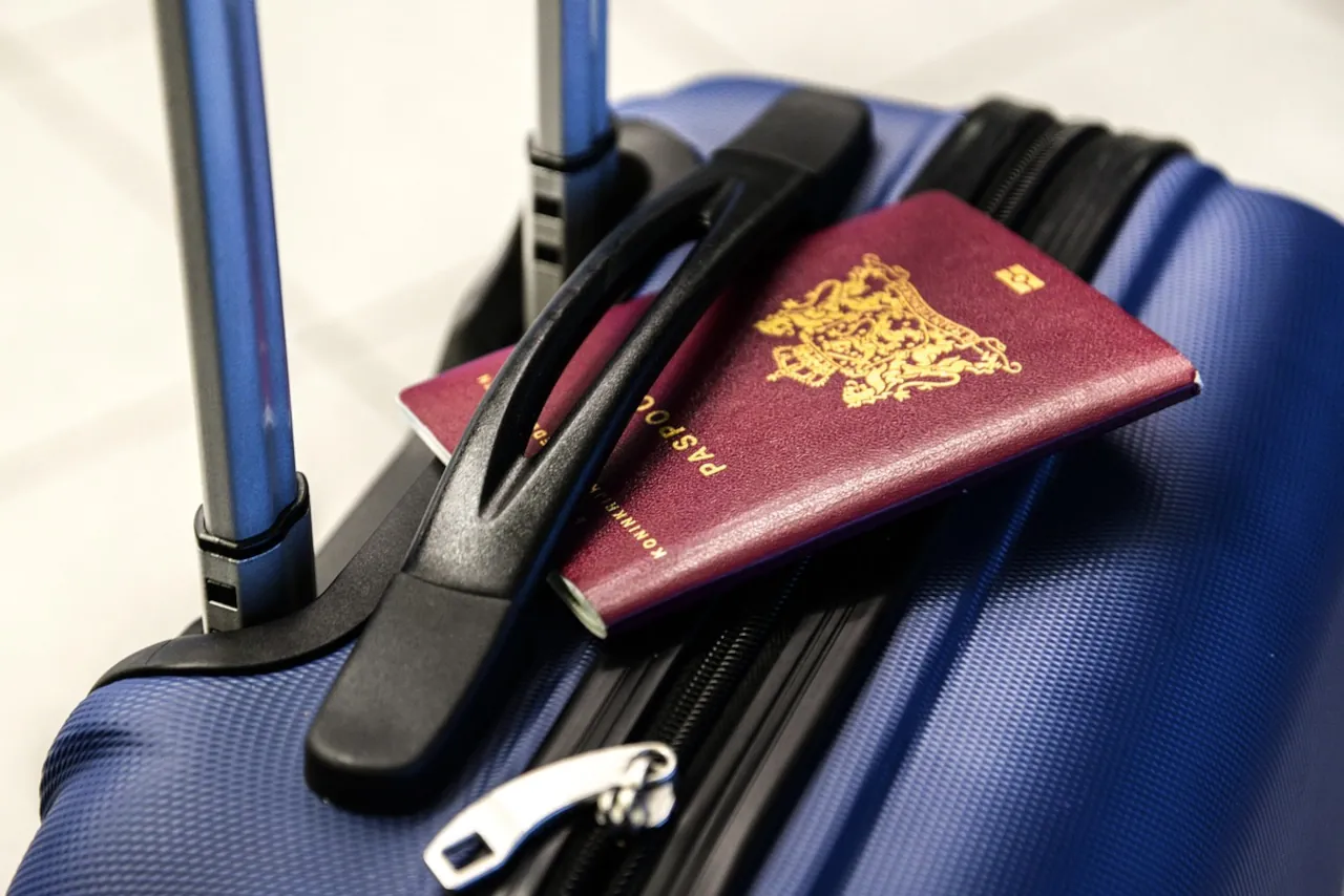 passport-on-suitcase-airport-travel Passport placed on a suitcase at the airport before international travel