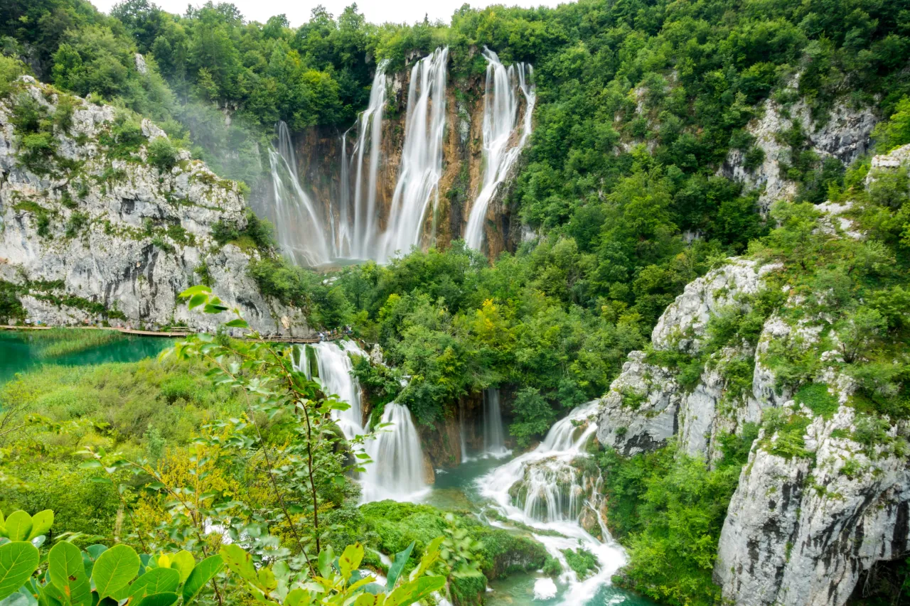 plitvice-lakes-croatia-waterfalls-groups Panoramic view of Plitvice Lakes with waterfalls and turquoise water in Croatia