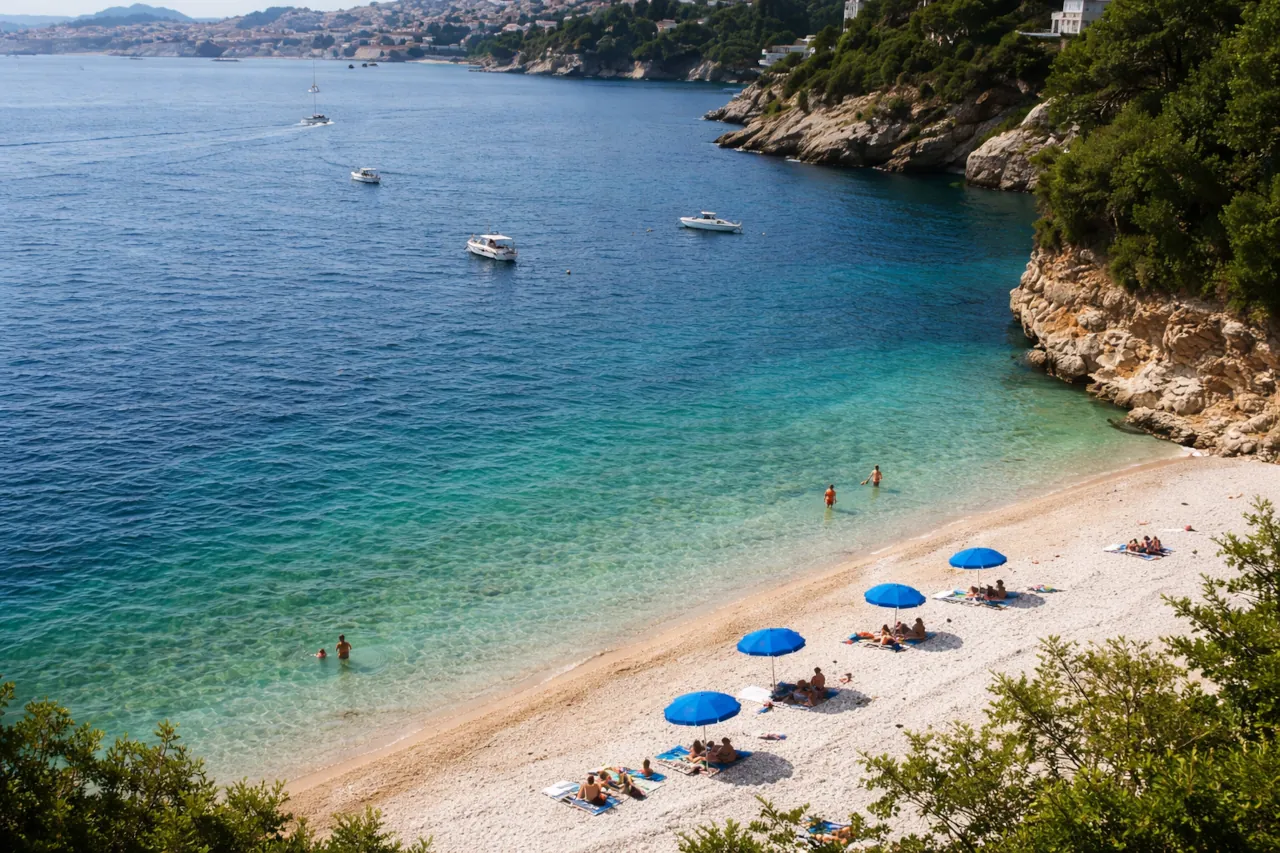 sveti-jakov-beach-dubrovnik-aerial-few-people Sveti Jakov beach Dubrovnik Croatia aerial view with few umbrellas and swimmers