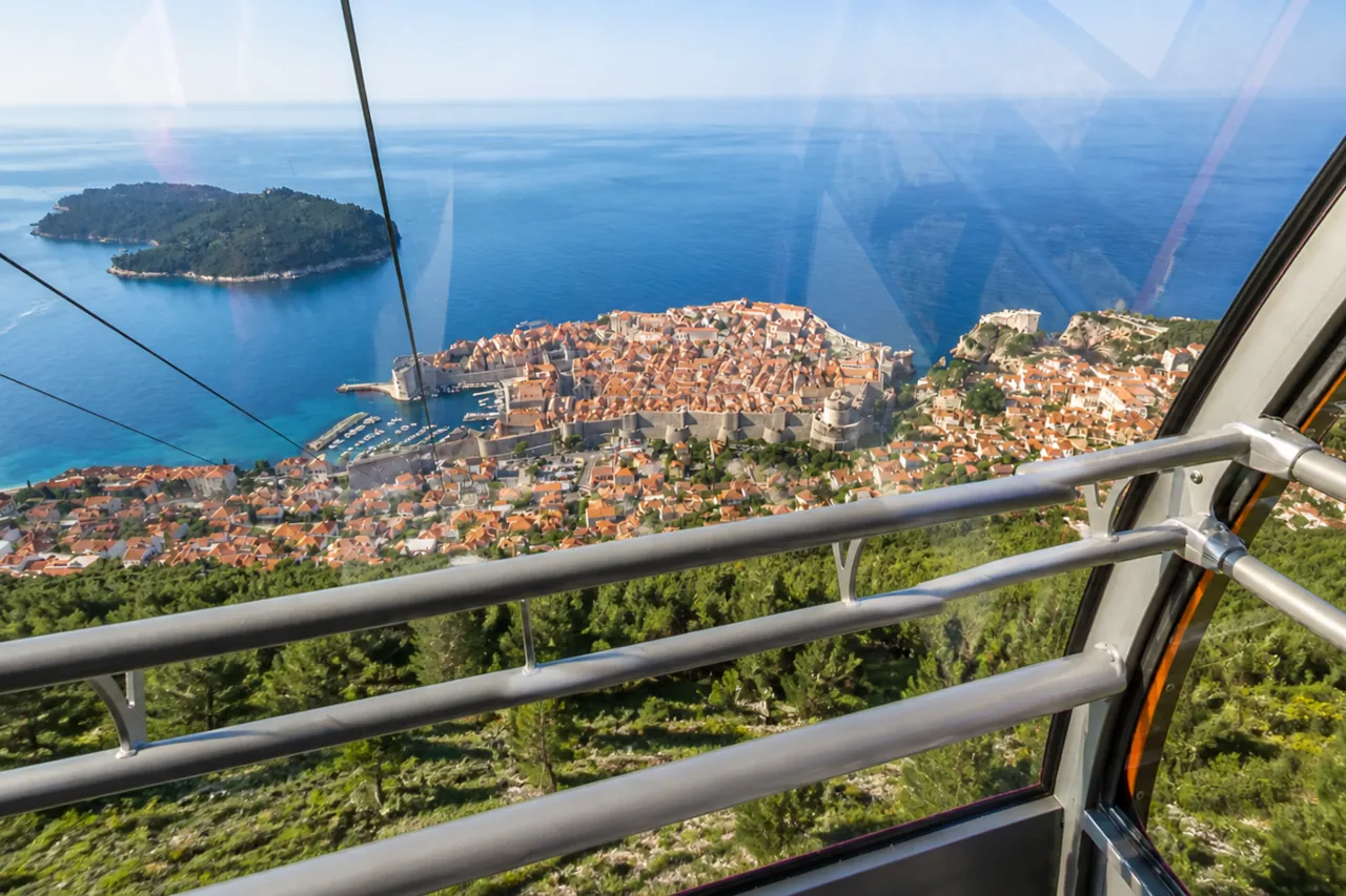 dubrovnik-cable-car-view-old-town-from-cabin View from Dubrovnik cable car cabin overlooking Old Town, Adriatic Sea and Lokrum island