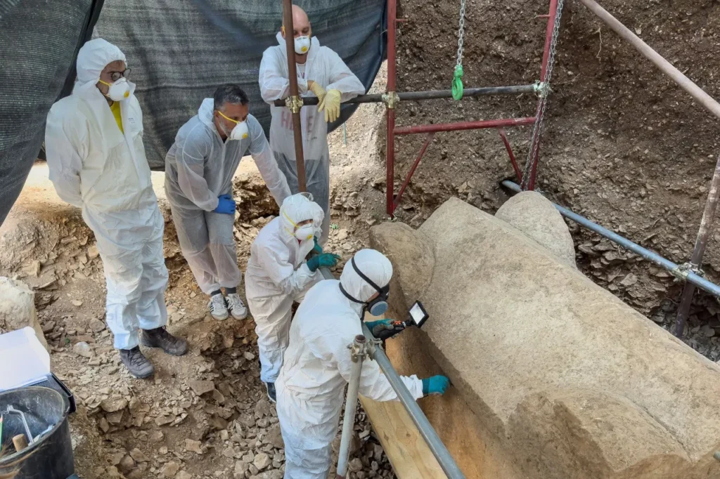 Archaeologists examining a Roman sarcophagus found in Cavtat during excavations near ancient Epidaurum