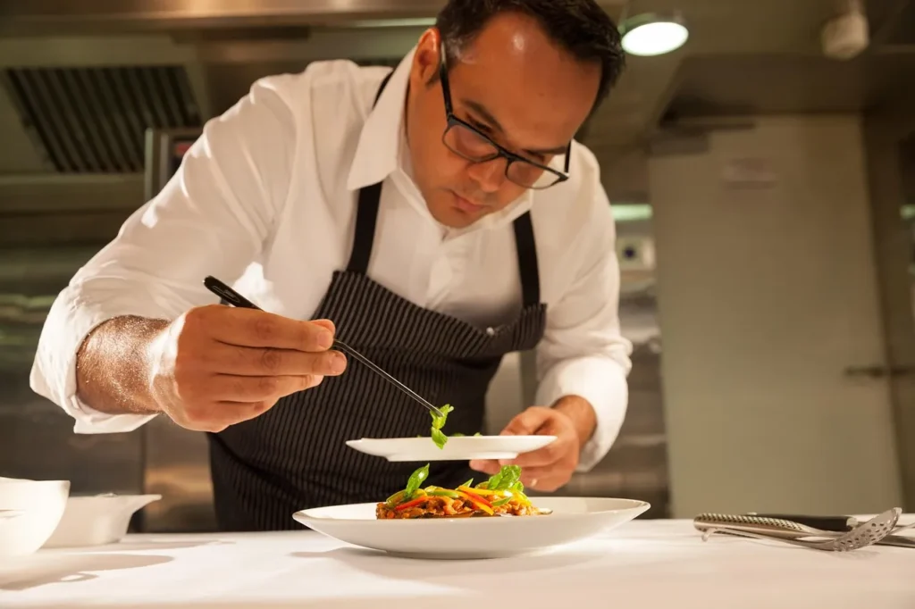 Chef plating a fine dining dish illustrating Michelin Guide Croatia restaurant