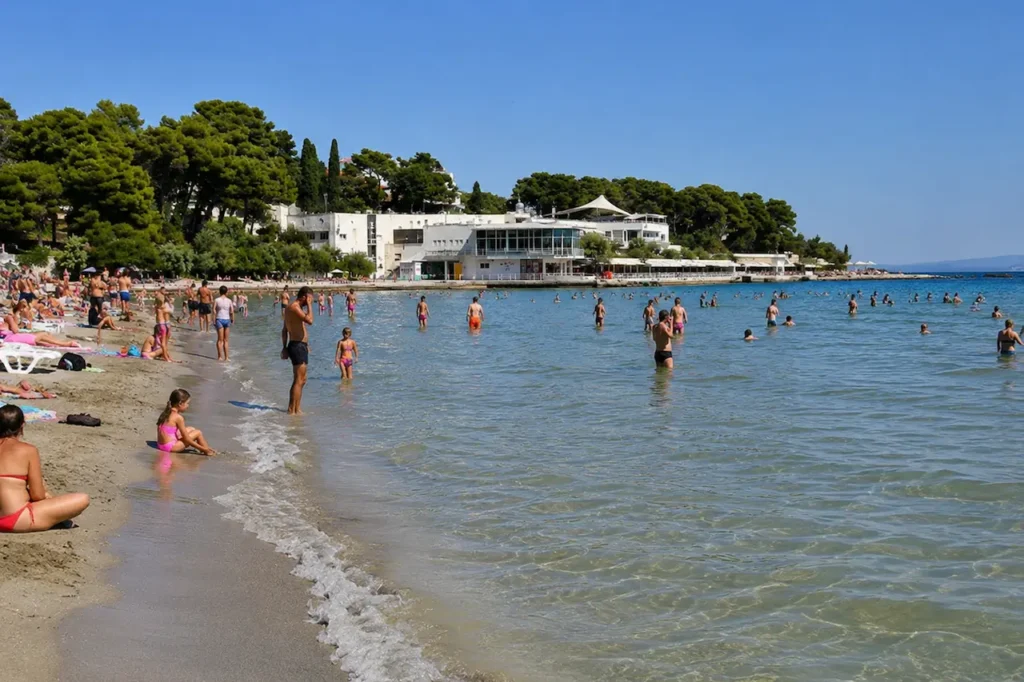 Swimmers in the shallow water at Bačvice Beach in Split, Croatia