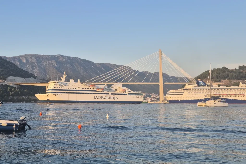 Ferry from Croatia to Italy Dalmacija sailing near Dubrovnik Bridge