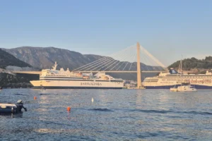Ferry from Croatia to Italy Dalmacija sailing near Dubrovnik Bridge