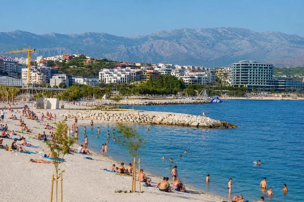 Swimmers and sunbathers at Žnjan Beach in Split, Croatia